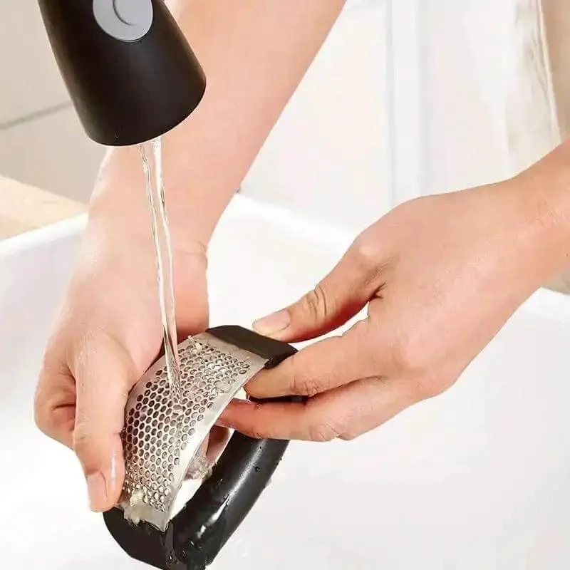 Stainless Steel Garlic Press Rocker Mincer With Peeler And Scraper For Easy Garlic Prep No Mess Rust Resistant Kitchen Gadget For Fast Chopping Great For Home Cooks Who Want Quick Mess Free Garlic Prep And Effortless Flavor Boost - Image 2